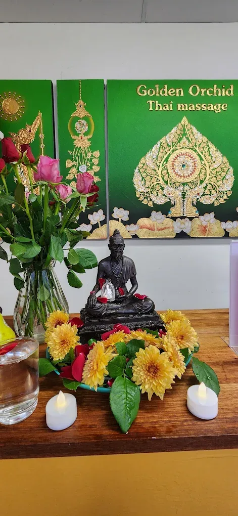 Thai shrine with flowers at Golden Orchid